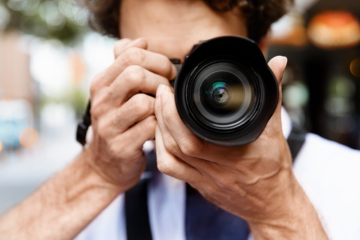 a man is taking a photo with a camera